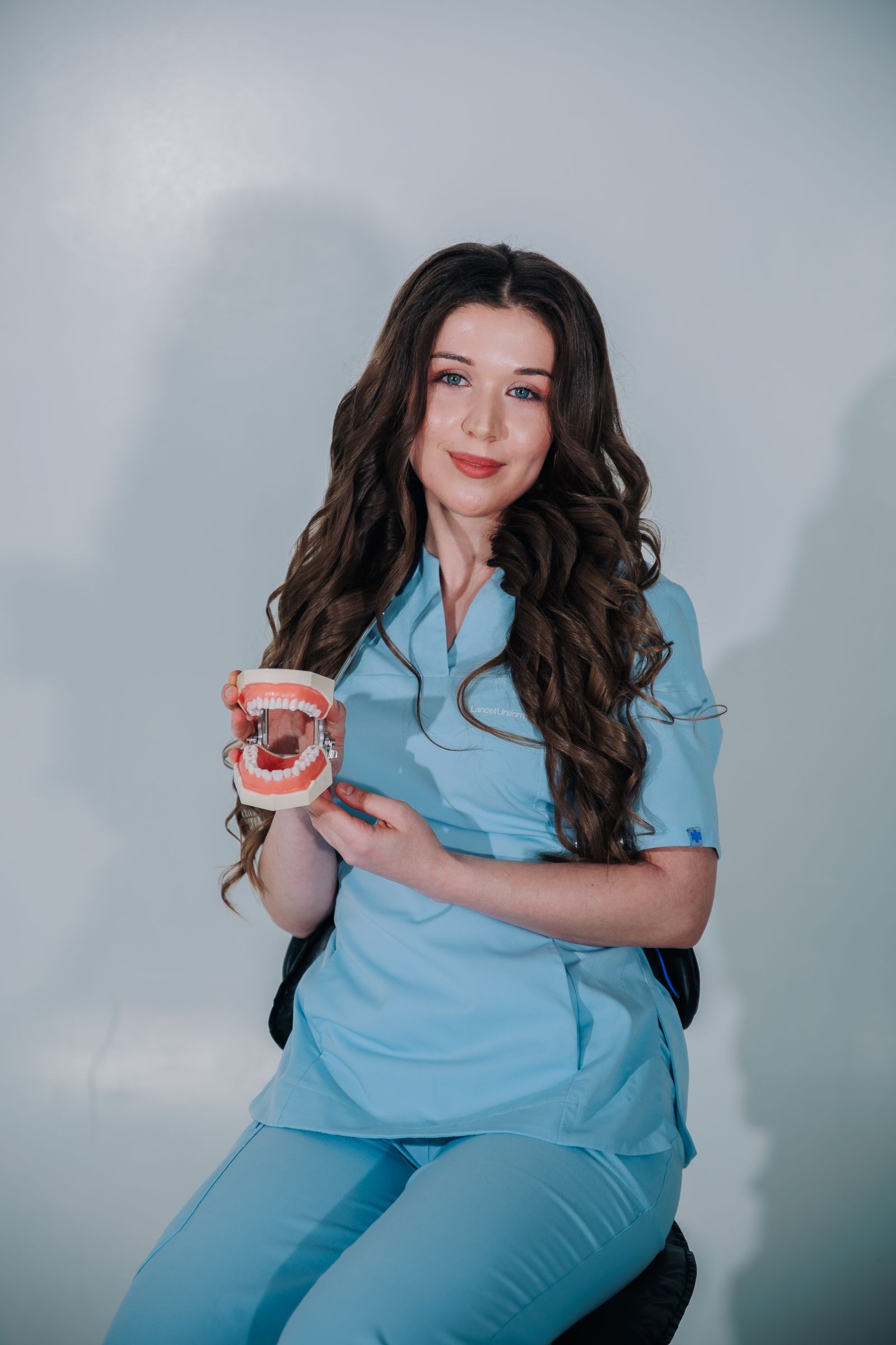 Northstar team member holding a dental model