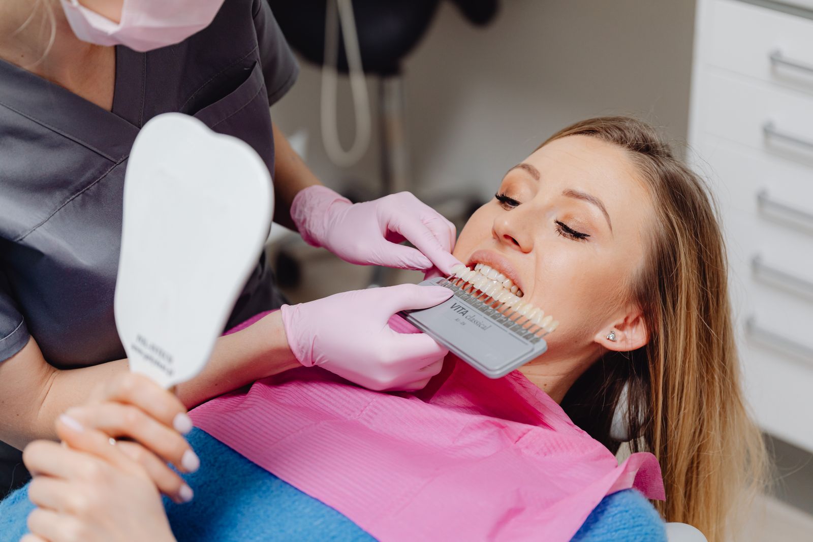Dental assistant preparing an instrument tray